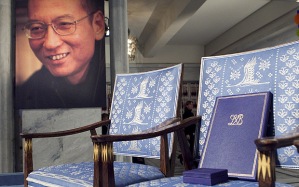 The empty chair with a diploma and medal that should have been awarded to this year's Nobel Peace Prize winner Liu Xiaobo (portrait l) stands in  Oslo City Hall on December 10, 2010. The head of the Nobel committee placed this year's peace prize on an empty chair  as Beijing raged against the award to dissident Liu Xiaobo, who is languishing in a Chinese prison cell. AFP Photo : Heiko Junge / SCANPIX NORWAY (Photo credit should read Junge, Heiko/AFP/Getty Images)